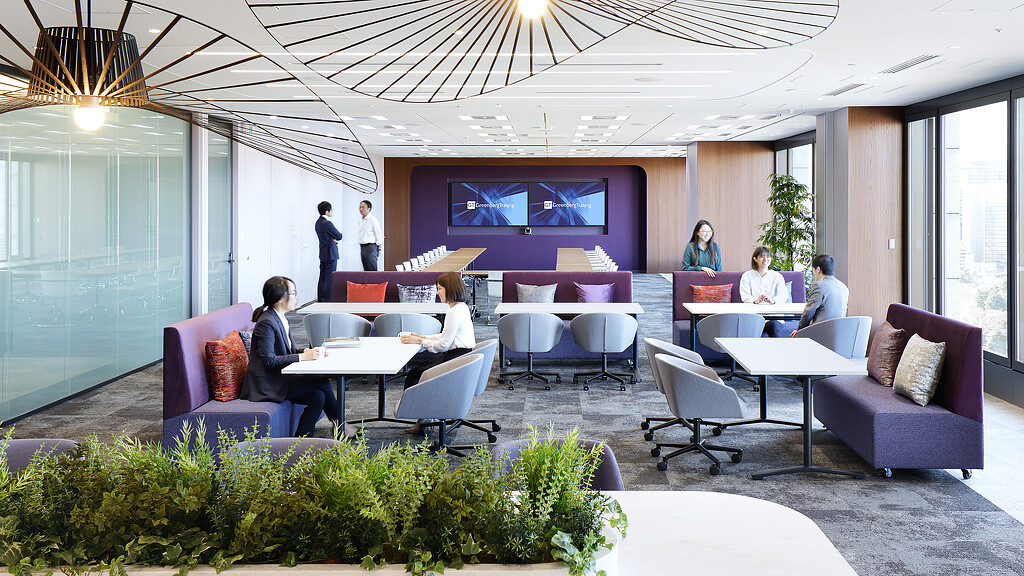 A group of people sitting around a table.